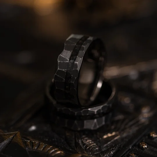Buy More, Save More – Special Jewelry Discounts "Zeus" Distressed Hammered Dinosaur fossil - Tungsten Carbide Ring- Black w/ Blue - Black Dinosaur Bone- 8mm Buy More, Save More – Special Jewelry Discounts "Zeus" Distressed Hammered Dinosaur fossil - Tungsten Carbide Ring- Black w/ Blue - Black Dinosaur Bone- 8mm